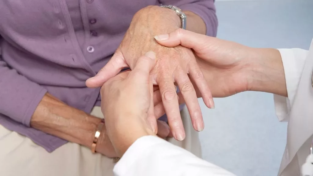 0_rheumatoid-arthritis-general-practitioner-examining-patient-and-hand-for-signs-of-rheumatoid-arthrijfif